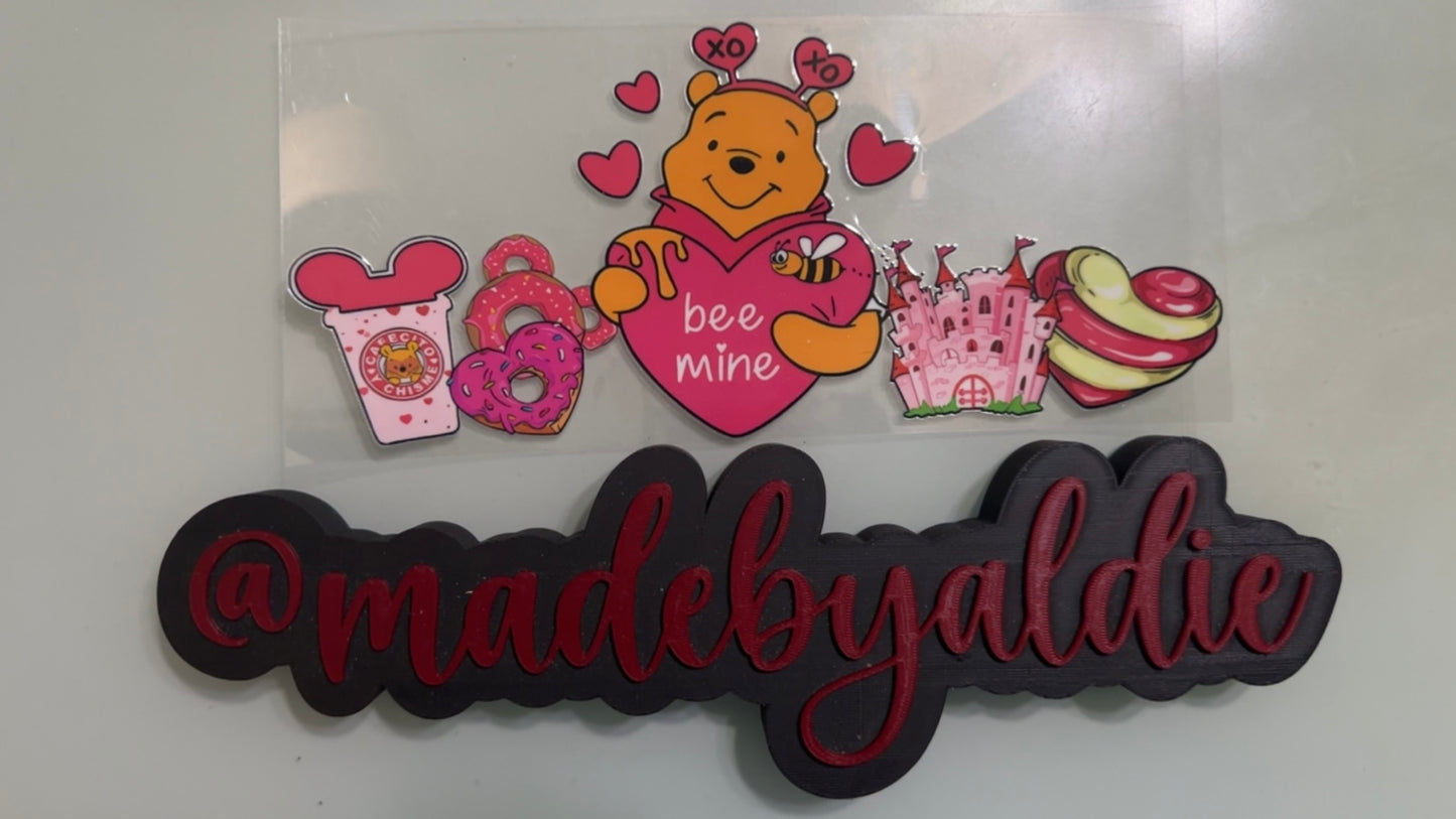 pooh holding bee mine heart