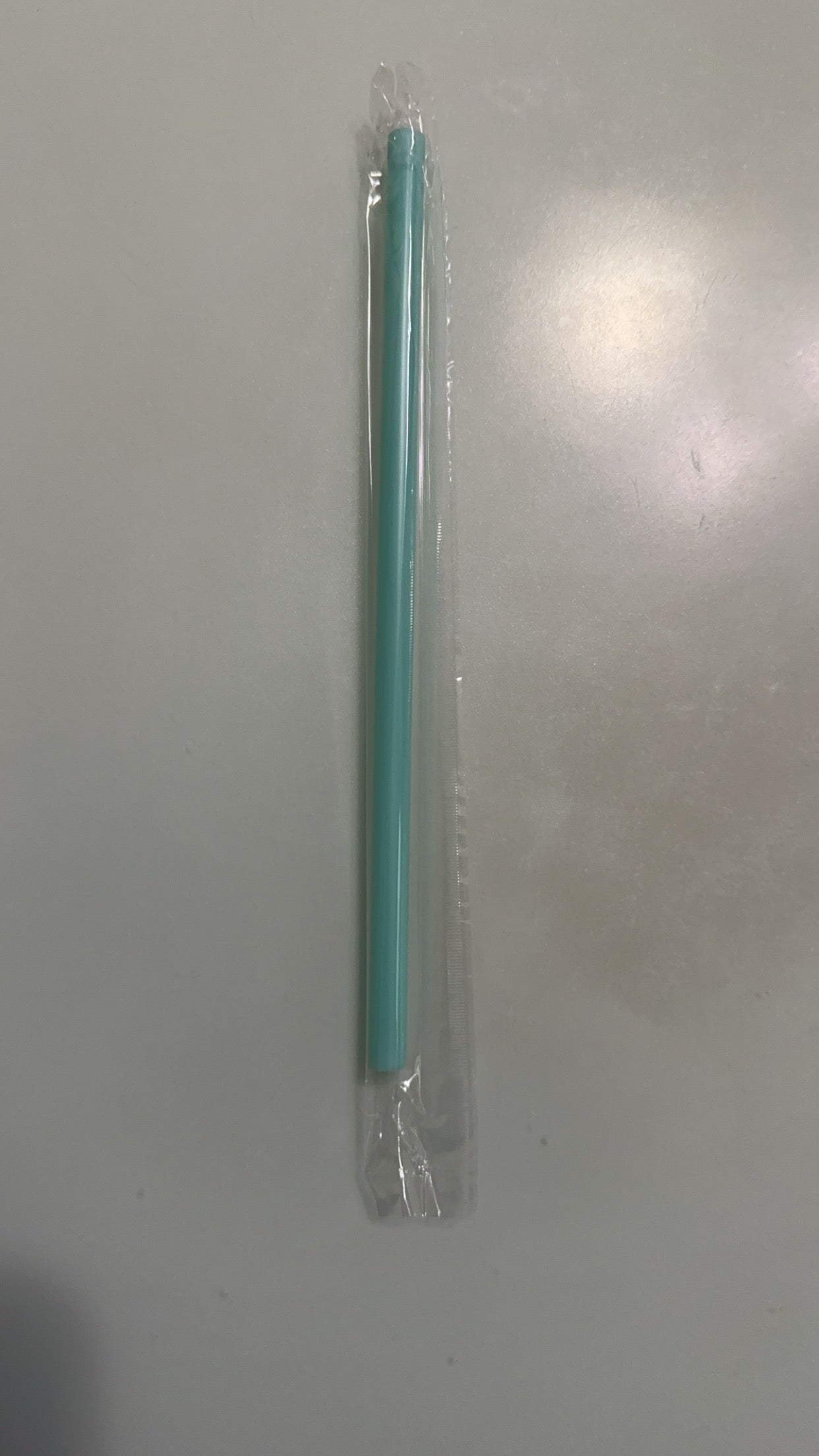 teal plastic straw