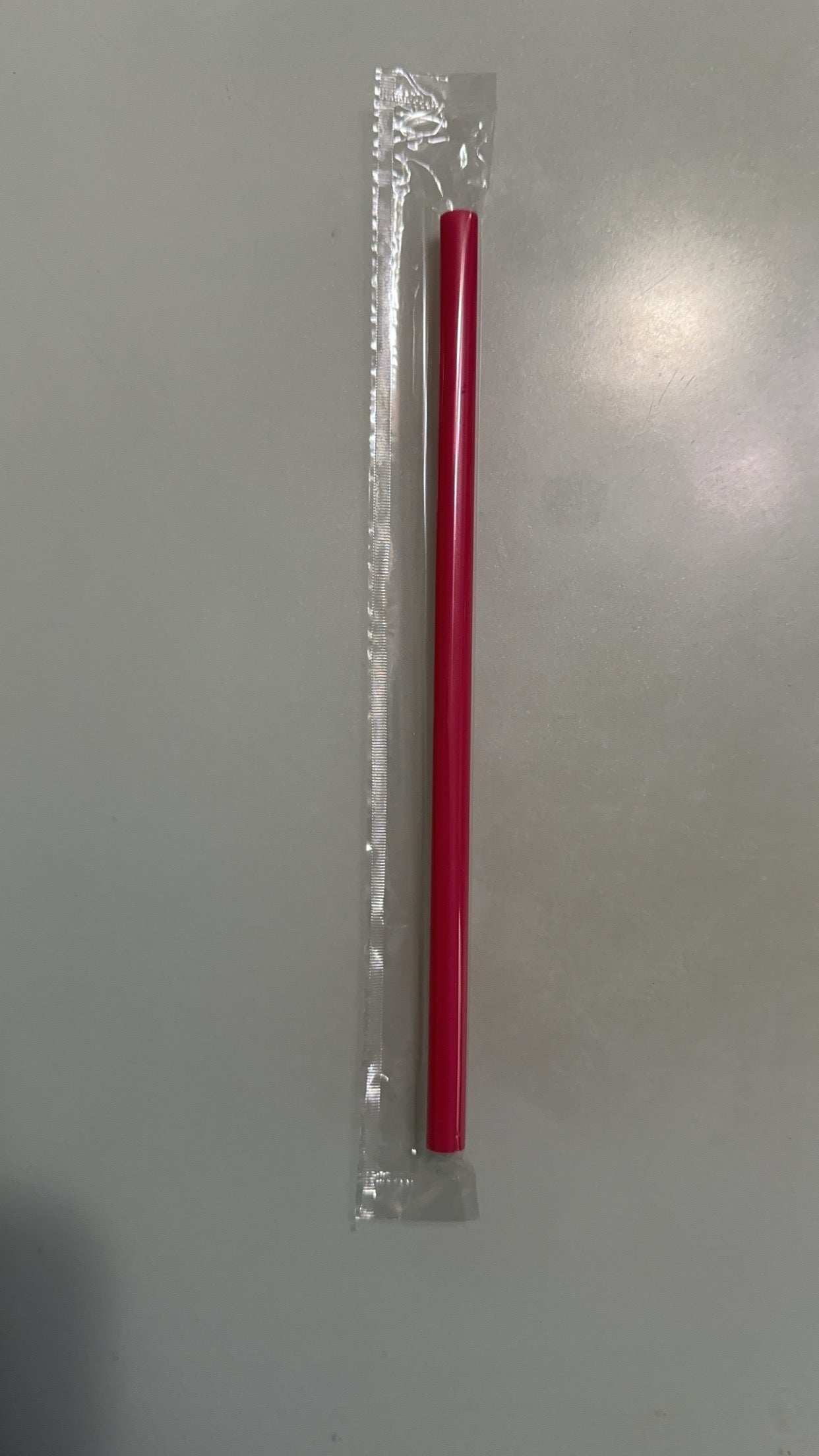 hot pink plastic straw