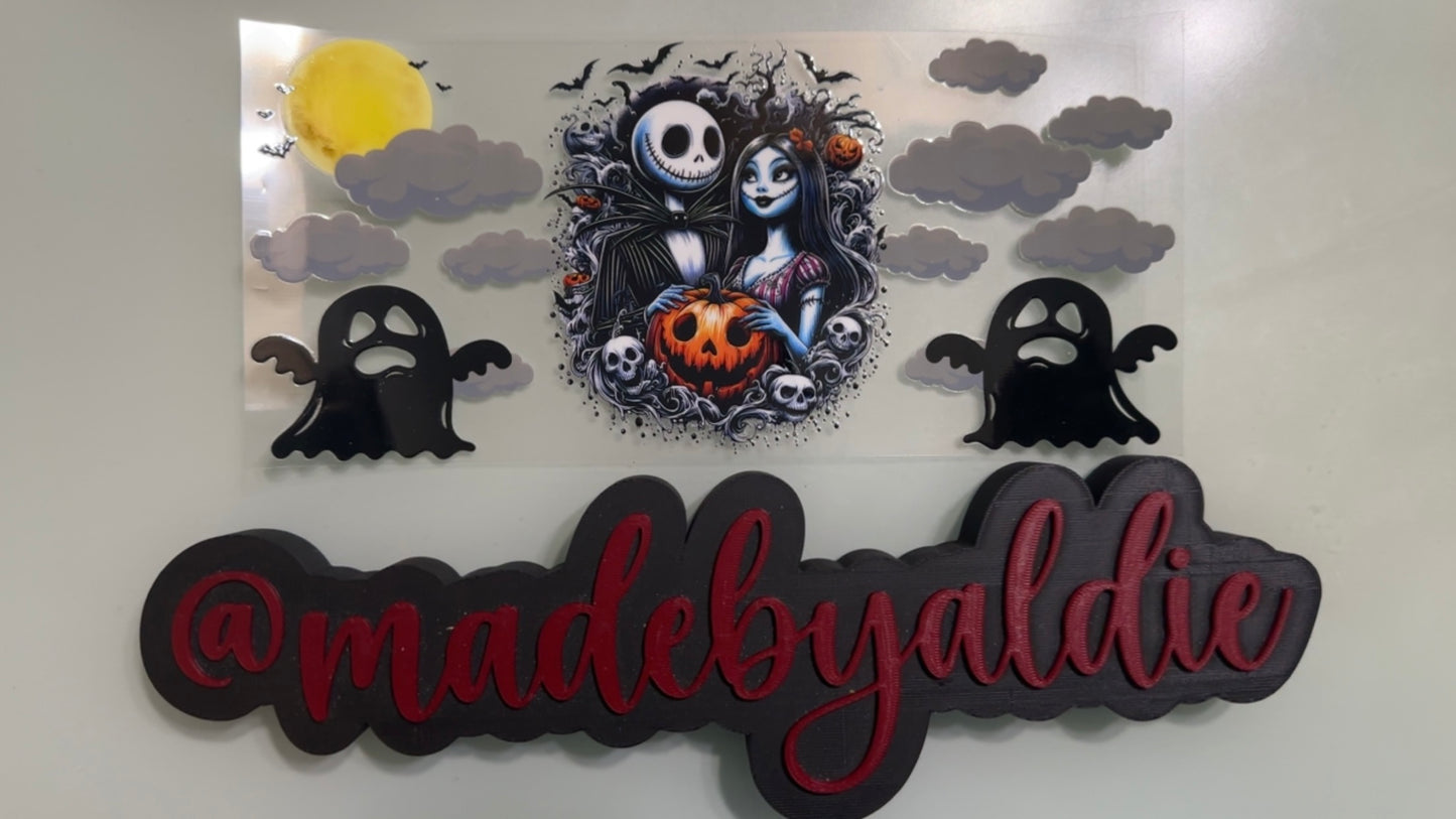 jack & sally holding pumpkin