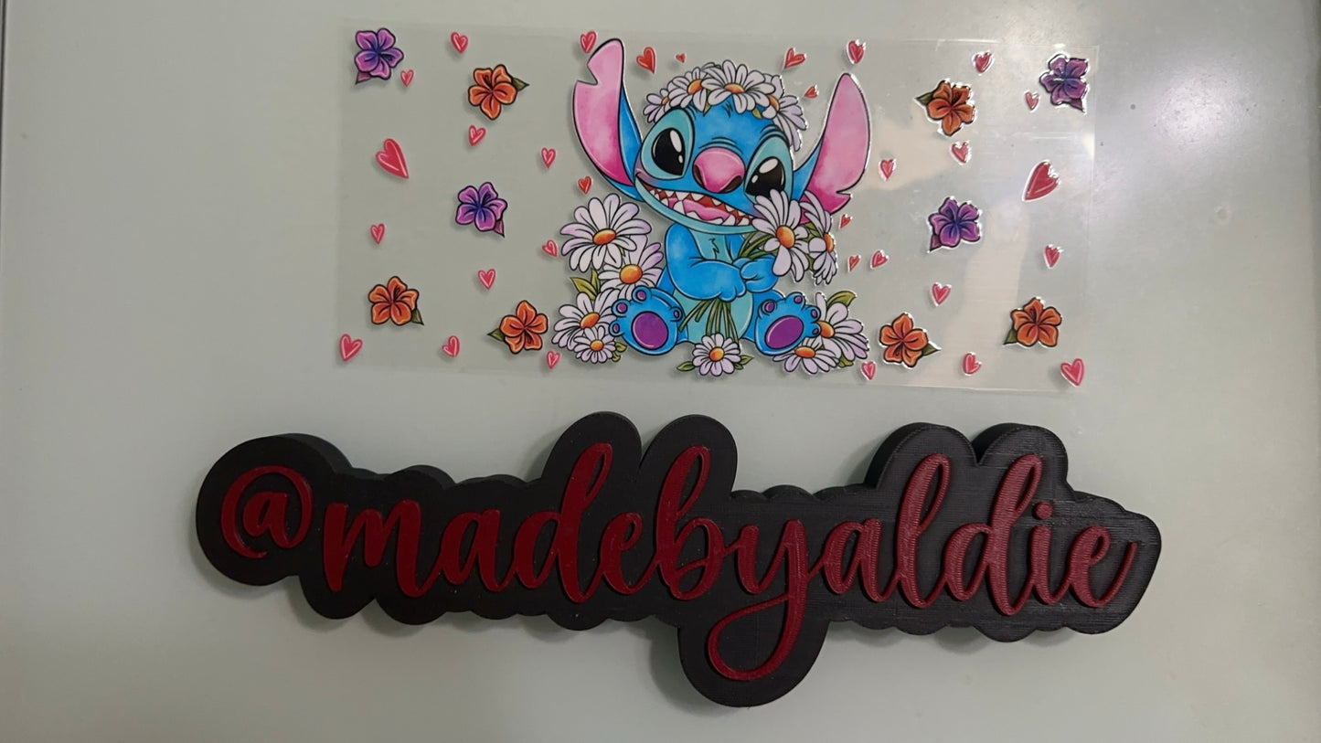 stitch holding daisies